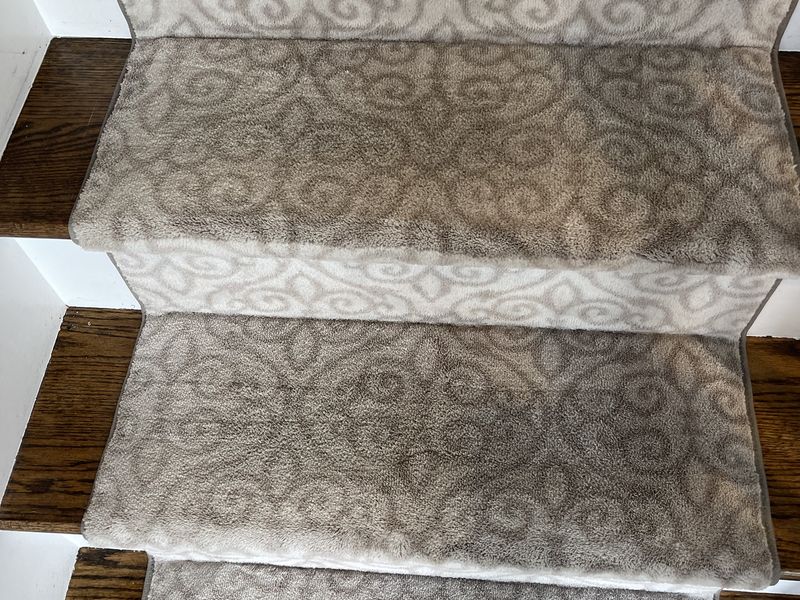 The same scroll-pattern stair runner after cleaning by Dr. Carpet18